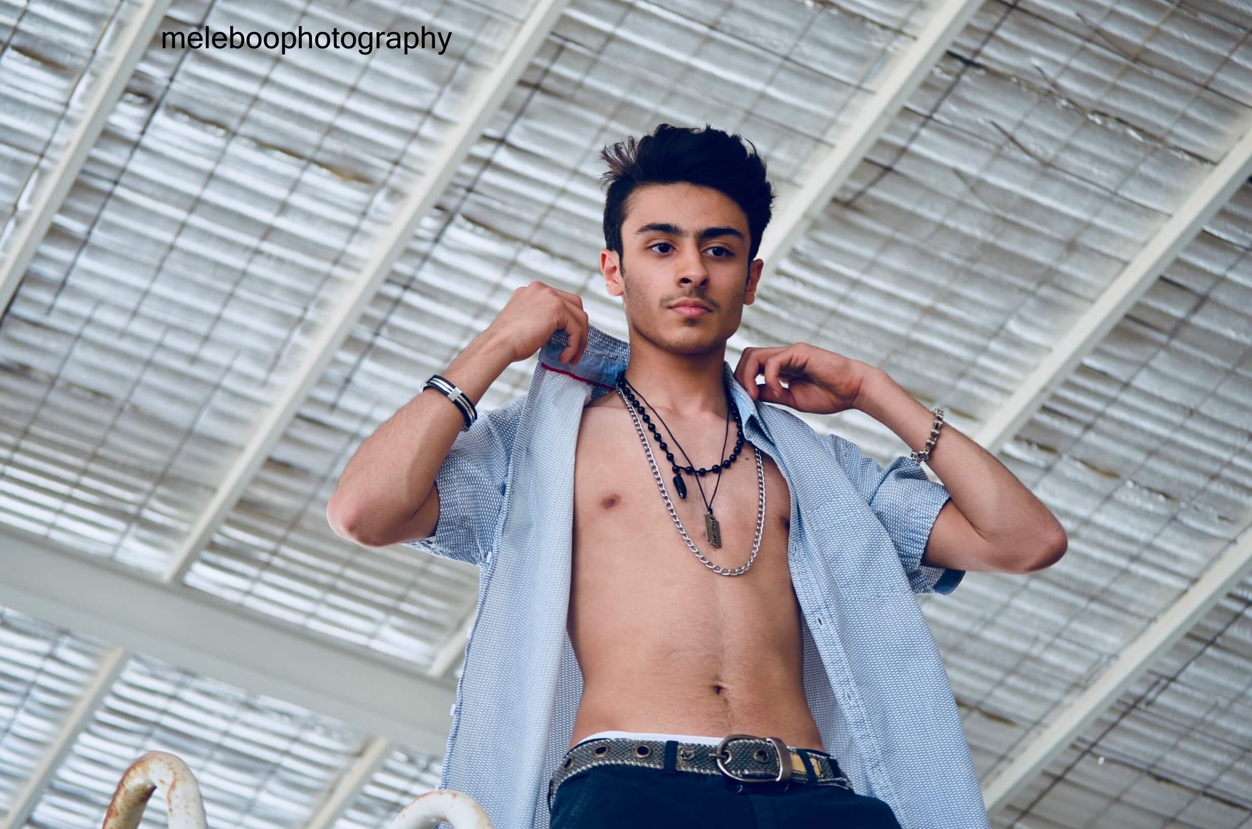 hassan adjusting shirt