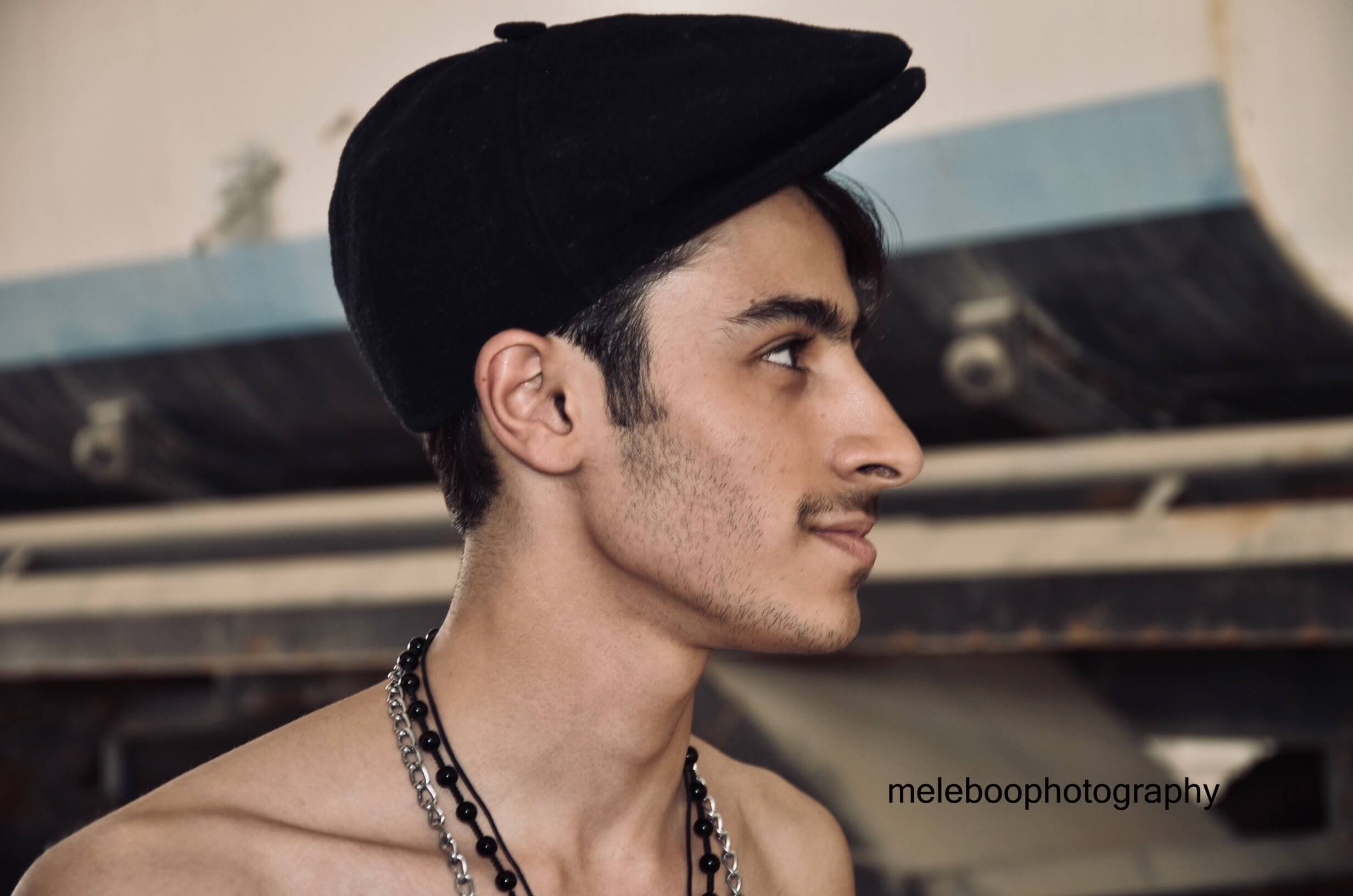 hassan wearing black cap