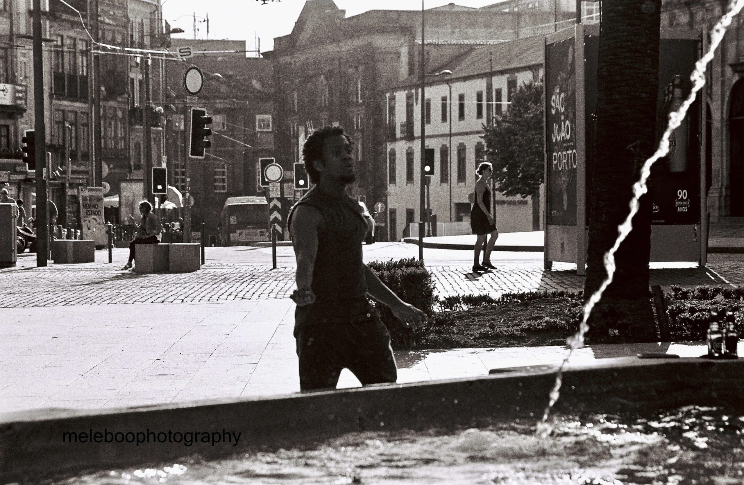young man dancing in street