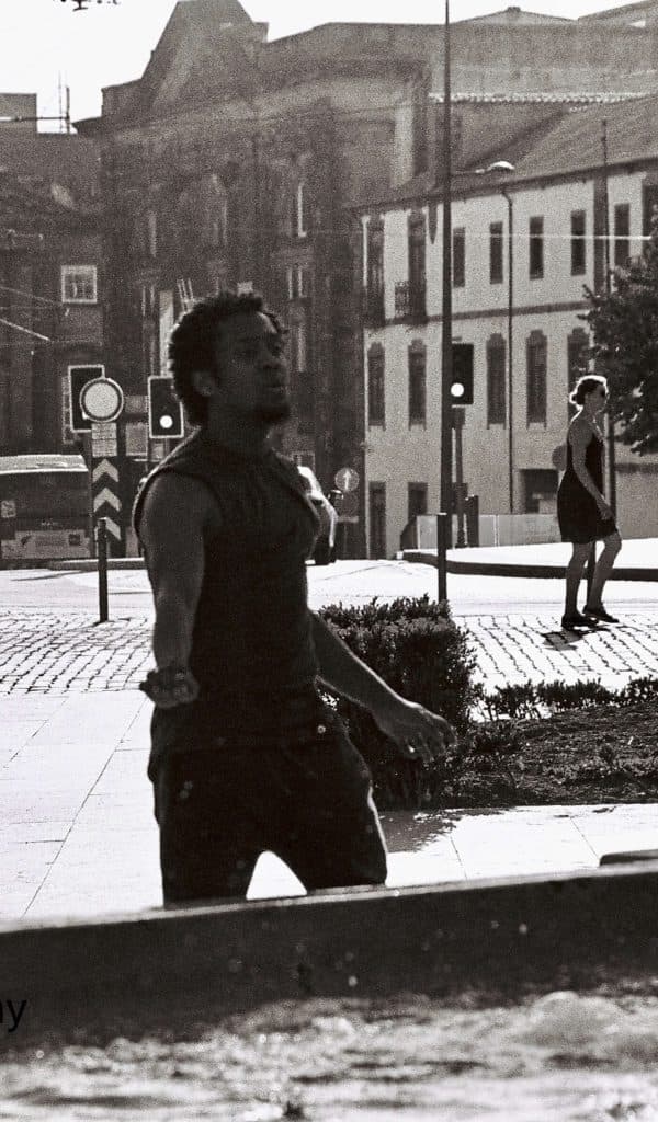 young man dancing in street